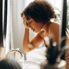 Young woman feeling ill whilst on antibiotics